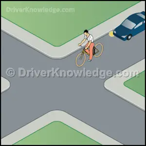 a bicyclist ahead of you
