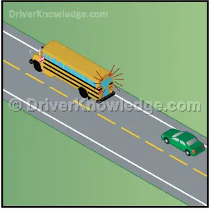 school bus is stopped on a 2 way undivided road with flashing red lights