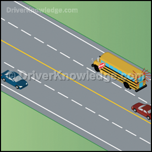 school bus stopped on a four lane road